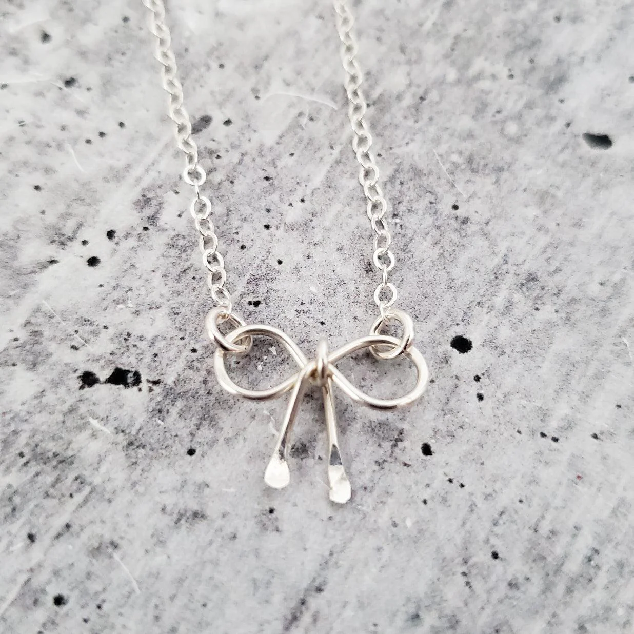 Dainty Bow Necklace by Salt and Sparkle - Image 3